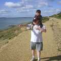 Hamish, with Bruce on piggy-back, points out to sea