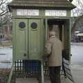 An old dude tries to make a phone call from one of the exhibits: an old Swedish telephone kiosk