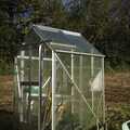 Possibly the tiniest (real, as in aluminium and glass) greenhouse in the world