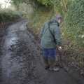 Matt clears out a leaf-clogged drainage ditch
