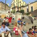 Tourists and local alike soak up a bit of evening sunshine on the Spanish Steps in Rome