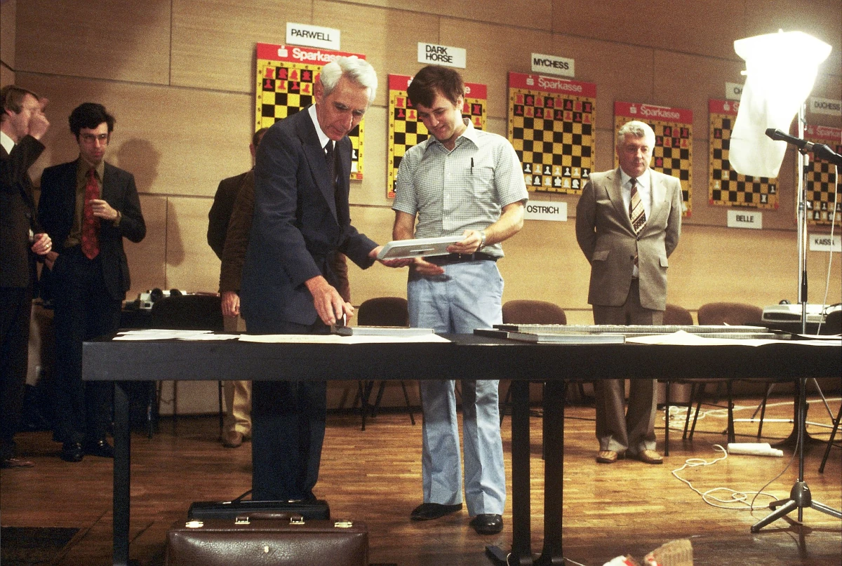 Claude Shannon - left of centre, and known as the father of computer chess - makes a guest appearance at the Third World Computer Chess Championship held during the Ars Electronica Festival in 1980. David Levy is on the left. Credit: LIVA–Linzer Veranstaltungsgesellschaft mbH, CC BY-NC-ND 2.0