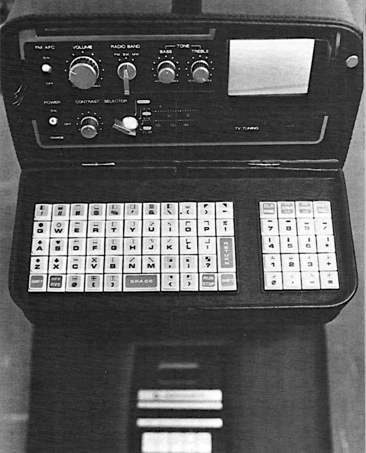 A close-up of the entertainment console and cocktail cabinet, showing radio controls, the miniature 3