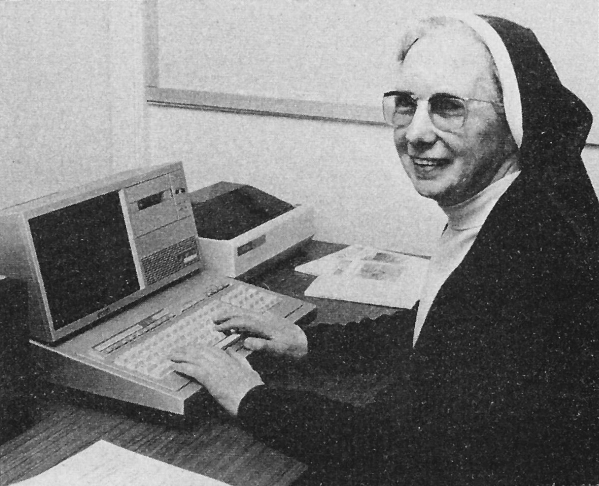 Sister Mary Agnes and the first UK installation of the <span class='hilite'>MZ-80B</span>. From Personal Computer World, February 1982