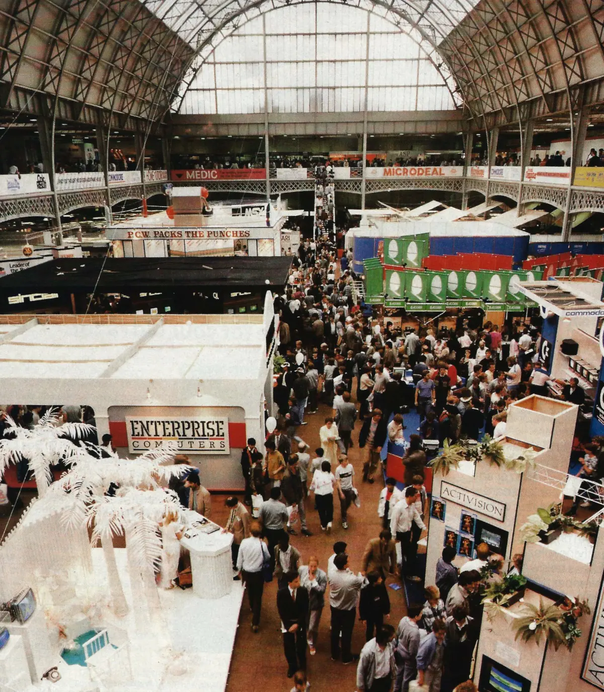 The 8th Personal Computer World Show at Olympia in 1985, with the Enterprise stand towards the front. From Personal Computer World, August 1986