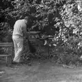 Andy Campbell sweeps leaves up, Life in Ford Cottage and Barton on Sea, Hampshire - 2nd April 1985