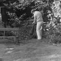 Fleabag scratches a flea as Andy sweeps, Life in Ford Cottage and Barton on Sea, Hampshire - 2nd April 1985