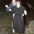 Steve and Sam hold something up, A Stuston Bonfire Night, Suffolk - 5th November 1989