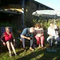 Alan tries to adjust the parasol, A Rabbit Barbeque, Dairy Farm, Thrandeston - 14th September 2003