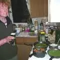 Wavy watches the veg over a can of Guiness, Mikey-P and Clare's House-Warming Thrash, Eye, Suffolk - 17th January 2004