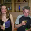 Jess looks over whilst John queries the shot, Jess and Jen's Party, Pulham St. Mary, Norfolk - 28th February 2004