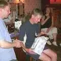 It's Phil's turn on 'pass the parcel', Wavy's Birthday at the Swan Inn, Brome, Suffolk - 24th May 2004