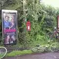 We cram in to a phone box to avoid the rain, The BSCC Annual Sponsored Bike Ride, The Cottage, Thorpe St. Andrew, Norwich  - 18th July 2004