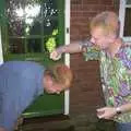 Orange and purple hair spray is applied, Paul's Stag Night, Brome, Scole and Bressingham - Friday 20th August 2004