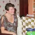 Sylvia unwraps a present, Christmas Day at the Brome Swan, Brome, Suffolk - 25th December 2004