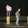 Marc climbs on to a bollard on the A140, New Year's Eve at The Swan Inn, Brome, Suffolk - 31st December 2004