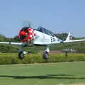 The Harvard takes off to do Thurston airshow, A Day With Janie the P-51D Mustang, Hardwick Airfield, Norfolk - 17th July 2005