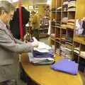 Peter checks a pile of clothing, A Portrait of Hopgoods: Gentlemen's Outfitters, Diss, Norfolk - 4th January 2006