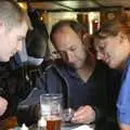 Phil, DH and Suey look at photos, The BSCC does The Pheasant Hotel, Kelling, Norfolk - 6th May 2006