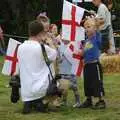 The Diss Express photographer wrangles kids, The Village Fête, Yaxley, Suffolk - 18th June 2006