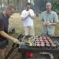 Tim Simpson pokes a sausage, Qualcomm Cambridge "Go Ape", High Lodge, Thetford Forest - 27th July 2006