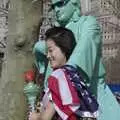 A people-dressed-as-statue snares a passing tourist, Liberty Island, A Helicopter Trip and Madison Square Basketball, New York, US - 27th March 2007