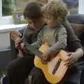 Isobel shows Rowan a few chords on the guitar, Nosher's Birthday Trip, New Milton, Hampshire - 26th May 2007