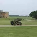 A jeep trundles around past the control tower, A 1940s Airfield Hangar Dance, Debach, Suffolk - 9th June 2007