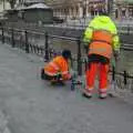 A work crew place lit candles along the river, Gamla Uppsala, Uppsala County, Sweden - 16th December 2007