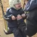 Isobel gives The Boy a go on the swings, A Trip To The Coast, Walberswick, Suffolk - 20th March 2011