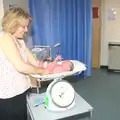 The baby is weighed at 4kgs on the scales, Sprog Day 2: The Sequel, Brook Ward, Ipswich Hospital - 28th March 2012