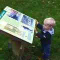 Harry checks an information sign, A November Miscellany and Building Progress, Thornham and Brome, Suffolk - 17th November 2013