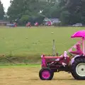 A stream of tractors comes in to the park, The Pink Ladies Tractor Run, Harleston and Gawdy Park, Norfolk - 5th July 2015