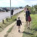 Harry and Isobel walk along the harbour road, A Short Trip to Southwold, Suffolk - 24th July 2016