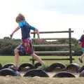 The boys run around the tyre ring, A Trip to Waxham Sands,  Horsey, Norfolk - 27th August 2016