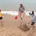 Isobel helps Fred dig a sandcastle out, A Wet Day at the Beach, Sea Palling, Norfolk - 16th July 2017