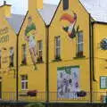 Guinness ads and GAA paintings on the Sneem Tavern, In The Sneem, An tSnaidhm, Kerry, Ireland - 1st August 2017