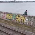 Someone sits on the sea wall, Fire and Water: The Burning of the Blackrock Centre, County Dublin, Ireland - 12th August 2017