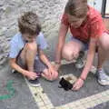 Isobel films the snail race, The Château Comtal, Lastours and the Journey Home, Carcassonne, Aude, France - 14th August 2018