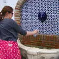 Isobel fills up a water bottle, An Easter Parade, Nerja, Andalusia, Spain - 21st April 2019