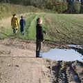 Harry points at a puddle and wonders how deep it is, A Walk Around the Avenue, Brome, Suffolk - 25th October 2020