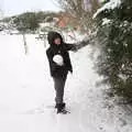 Fred shakes snow of a leylandii, Beast From The East Two - The Sequel, Brome, Suffolk - 8th February 2021