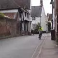 Harry and Isobel cycle up Church Street, BSCC Beer Garden Hypothermia, Hoxne and Brome, Suffolk - 22nd April 2021