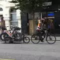 A cyclist with a trailer of bikes goes by, A Trip to Noddy's, and Dublin City Centre, Wicklow and Dublin, Ireland - 16th August 2021