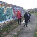 We walk past the graffiti sea wall, The Dead Zoo, Dublin, Ireland - 17th February 2023