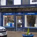 An E. Johnston Dispensing Chemist sign on a Boots, Lunch in Harleston, Norfolk - 1st March 2023