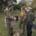 The re-enactors talk someone through their gear, A B-17 Memorial, The Oaksmere Hotel, Brome, Suffolk - 10th November 2023