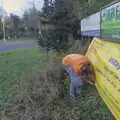 Isobel sticks up a panto banner near Scole, The Lost Architecture of Ipswich, Suffolk - 11th December 2023