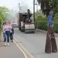 A dude on stilts looks back, The Carnival Procession, Diss, Norfolk - 16th June 2024