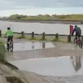 A couple of cyclists roar past, Eye Karate Kamp, Southwold Harbour, Suffolk - 6th July 2024